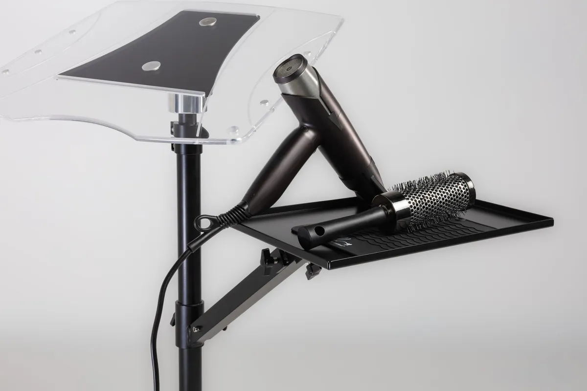 Styling tools arranged on an adjustable salon workstation